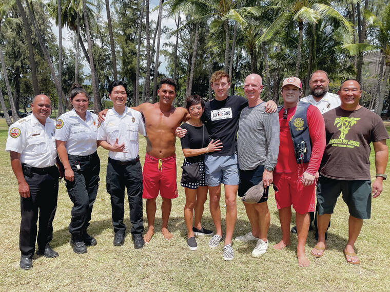 Family posing with rescuers