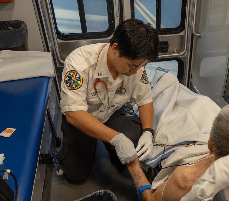 EMT helping a patient in an ambulance